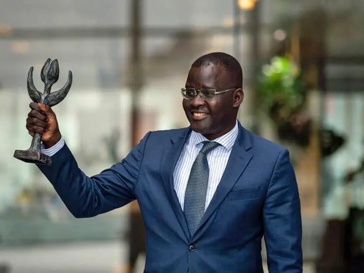 Nicholas-Opiyo-holding-the-Dutch-Human-Rights-Tulip-Award