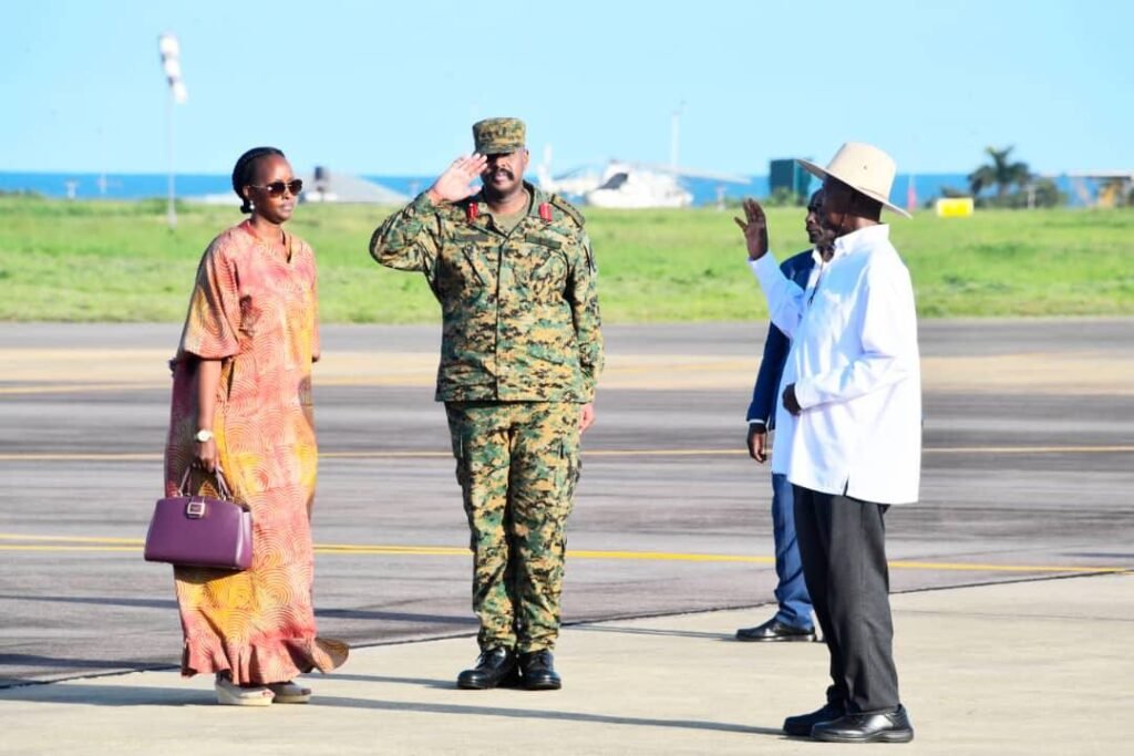 General Muhoozi Kainerugaba with wife Charlotte salute the commander in chief General Yoweri Kaguta Museveni (1)