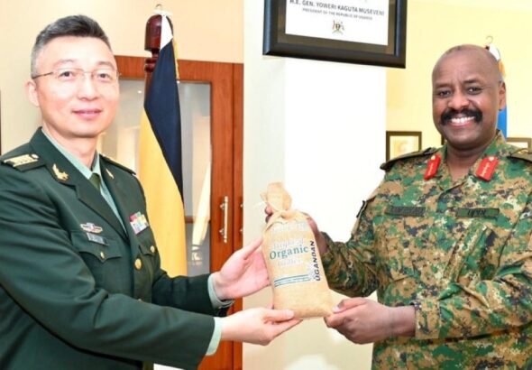 CDF Gen Muhoozi with a Chinese official