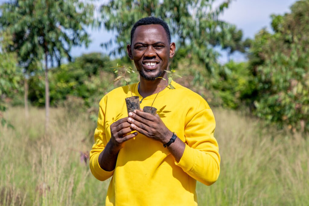 Edwin Kanyesigye  a travel Journalist took part in Re Greening Dolwe Island .  Photos by Barbra Lenni 